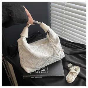 Detail view of a new Chinese style jacquard shoulder bag with elegant woven pattern and strap.