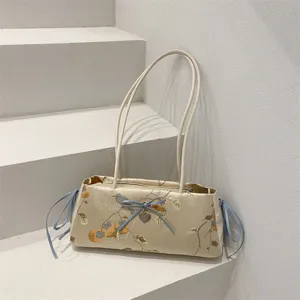 Chinese style satin shoulder bag for women, elegant underarm purse with blue bow and chic design.