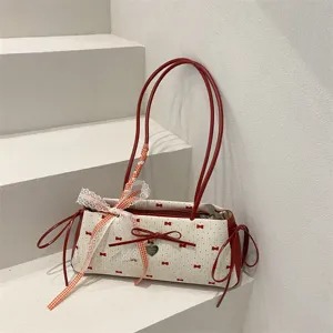 Cute red and white bow shoulder bag for women, stylish underarm handbag with lace ribbon.
