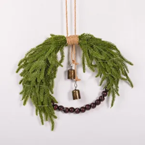 Christmas artificial Norfolk pine wreath with wood beads and vintage bells for wall hanging