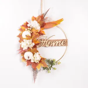 Autumn wreath front door decoration with artificial maple leaves pumpkins and Home wooden sign.