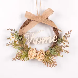 Detail shot of the rustic autumn artificial flower wreath featuring a wooden Home sign and burlap bow.