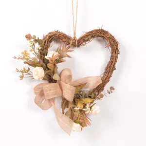 Vintage heart-shaped rattan wreath with artificial roses and burlap bow for home door wall decor.