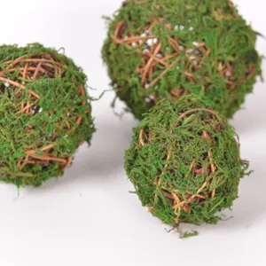 Detailed shot of green moss rattan balls, perfect for floral arrangement and home decor crafts.