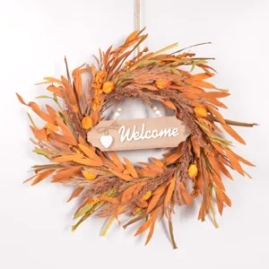 Autumn artificial wreath detail, wooden welcome sign, rustic harvest home decor close up.