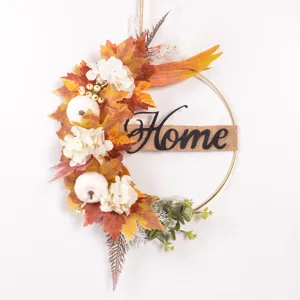 Autumn iron wreath wall hanging with artificial maple leaves, pumpkins and Home sign.