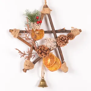 Rustic wooden star Christmas hanging decoration detail showcasing pinecones and dried orange slices.