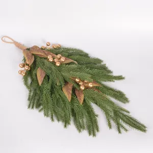 Close-up details of Nordic Christmas wall hanging featuring pine needles and golden berries.