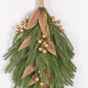 Norfolk pine needle Christmas teardrop swag wall hanging detail with gold berries and leaves.