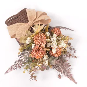 Artificial flower wall hanging with rattan basket and burlap bow for home decor wedding.
