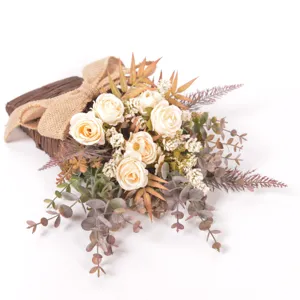 Detail view of artificial rose flower bouquet in a rattan basket with burlap bow decoration.