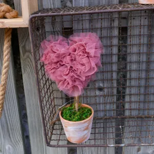 Pink tulle heart topiary detail shot, rustic desktop decoration for romantic wedding and home.