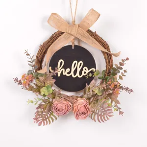 Artificial autumn retro flower wreath detail view, vintage vine floral door hanging sign.
