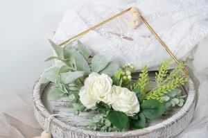 Nordic artificial flower wall hanging with iron frame and white roses for home decor display.