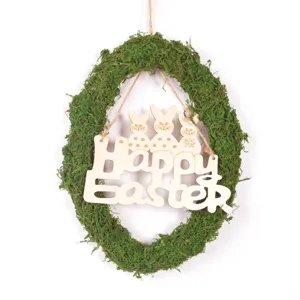 Easter moss egg wreath hanging detail with wooden bunny plaque and natural green spring decor.