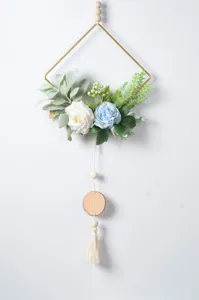 Nordic wall hanging decor with gold metal frame, artificial flowers, wood beads and tassel.
