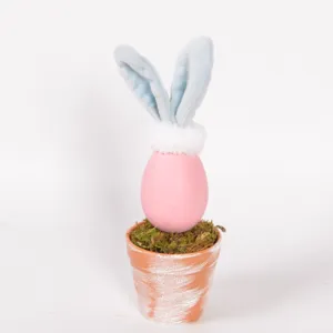 Cute Easter egg rabbit potted plant ornament with plush bunny ears and moss decor for home.