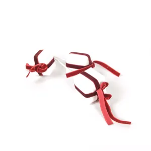 Mini Christmas gift box ornament with red velvet ribbon for DIY tree decor detail view.