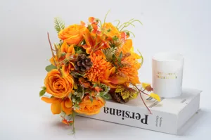 Close-up detail view of autumn artificial flower bouquet with vintage roses for home decor.