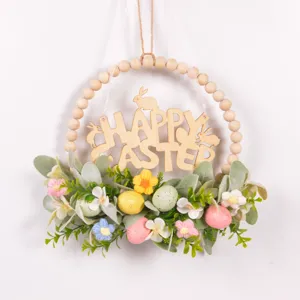 Easter wooden bead wreath wall hanging with faux lamb's ear leaves, speckled eggs and flowers.