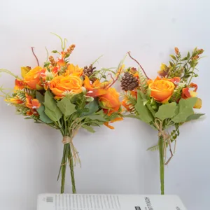 Autumn artificial rose flower bouquets with pinecones, retro floral arrangement for home decor.