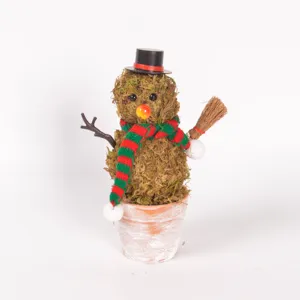 Close-up detail of the handmade moss snowman potted ornament with mini top hat and broom.