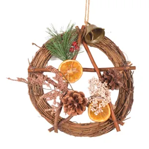 Vintage Christmas rattan pentagram wreath with pinecones and dried orange slices for door hanging.