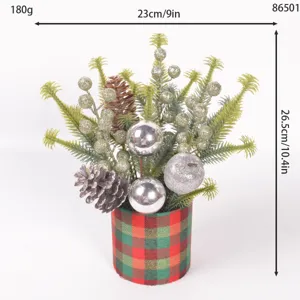 Christmas tabletop decoration potted plant with faux pine branches berries and glitter balls.
