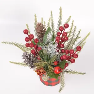 Christmas desktop potted decoration featuring artificial pine branches and sparkling red glitter berries.