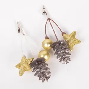 Christmas decorative pine cone star clip detail, festive craft accessory for holiday tree.