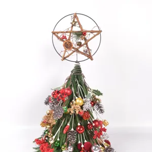 Christmas tree topper decoration set with pinecones berries baubles and rustic star design.