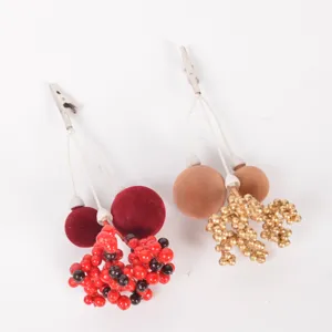 Christmas decorative clips with velvet balls and berries, ideal for tree and gift DIY.