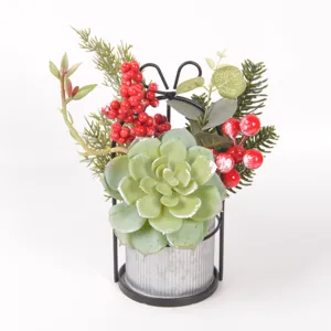 Artificial succulent potted plant with red berries in metal pot for Christmas decor