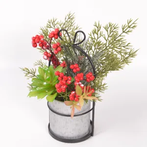 Christmas artificial succulent red berry potted plant metal bucket home decor detail close-up