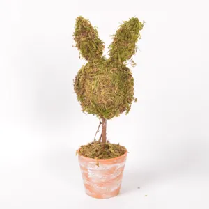Close-up detail of Easter moss rabbit topiary, featuring realistic green moss ears and pot.