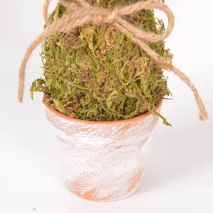Close-up detail of Easter moss rabbit ornament in a distressed pot with jute twine.