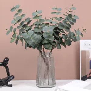 Artificial eucalyptus branches in glass vase faux plant greenery home decor floral arrangement