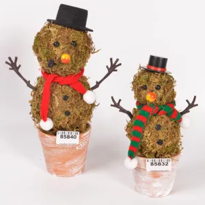 Handmade moss snowman potted plant with knitted scarf and vintage pot for Christmas decor.