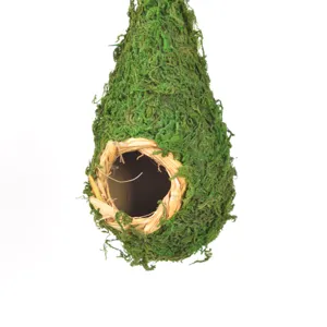 Close-up detail view of natural moss hanging birdhouse, perfect for garden decoration and pets.