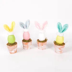 Easter egg bunny potted decoration with moss and cute plush ears for spring holiday home display.