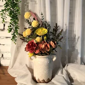 Detailed view of autumn artificial flower bouquet in vintage ceramic vase, perfect for home decor.