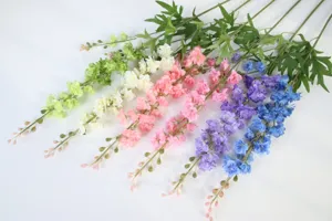 Artificial delphinium flower branches faux floral arrangement for wedding home decor detail.