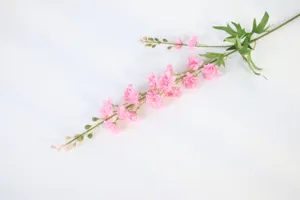 Detailed view of the artificial pink delphinium flower branch for floral arrangements.