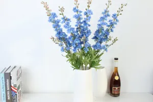 Artificial delphinium flower detail view, beautiful blue floral arrangement for home decor.