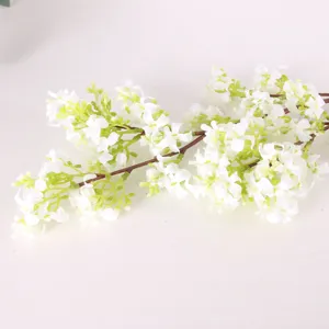 Artificial white flower branch detail view, perfect for home decor and floral arrangement.