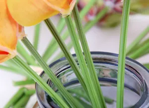Artificial orchid flower bouquet detail view, ideal for home living room and dining table decoration.