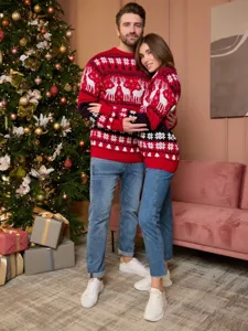 Matching Christmas couple sweaters with classic reindeer and snowflake jacquard design.