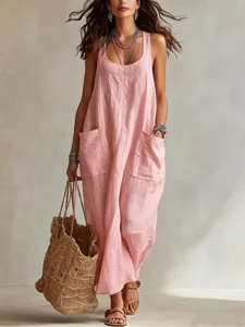 Detail view of pink loose sleeveless linen sling long dress with practical side pockets.