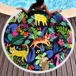 Round beach towel with colorful cartoon jungle animals print and tassels for summer pool party.