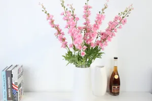 Artificial delphinium hyacinth silk flowers in white vase for wedding home decor detail view